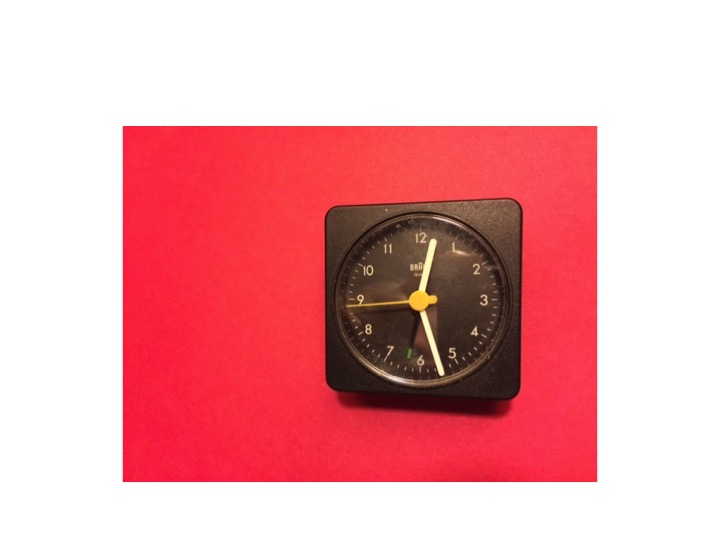 Then a sudden, clear image: a clock floating in the red.